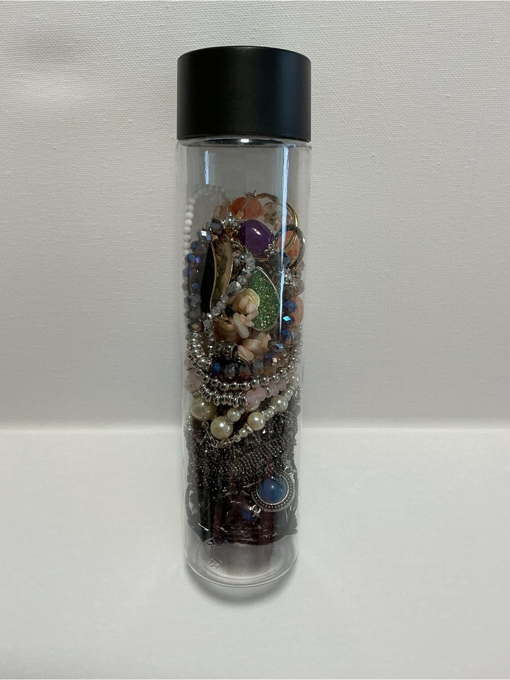 Clear Jewelry Tube Filled with 25 Mixed Costume Jewelry - Multicolor Items.